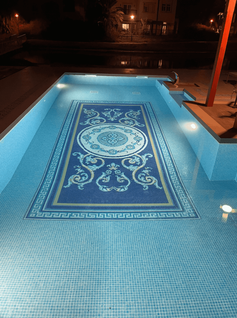 Dubai VIlla Custom glass mosaic tile swimming pool motif by MEC - image taken during night time