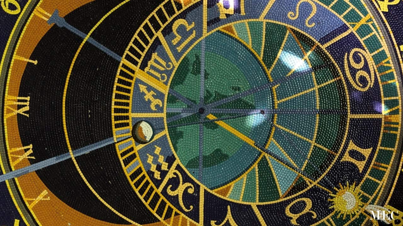 Orloj sun and moon dial mosaic tile floor medallion close up