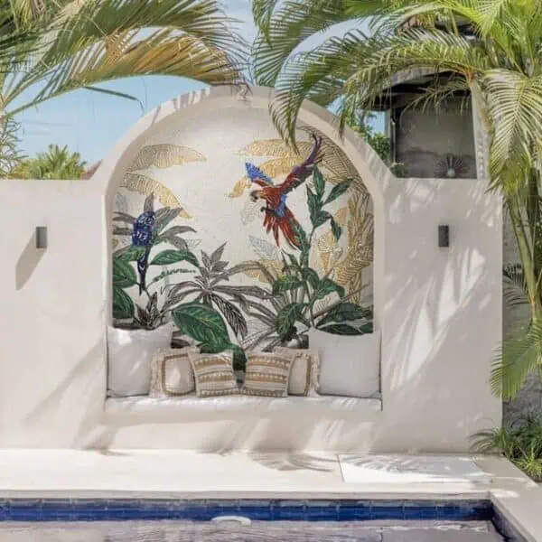 macaw toucan parrot bird mosaic tropical leaves gold glass mosaic pool area seating niche arched wall