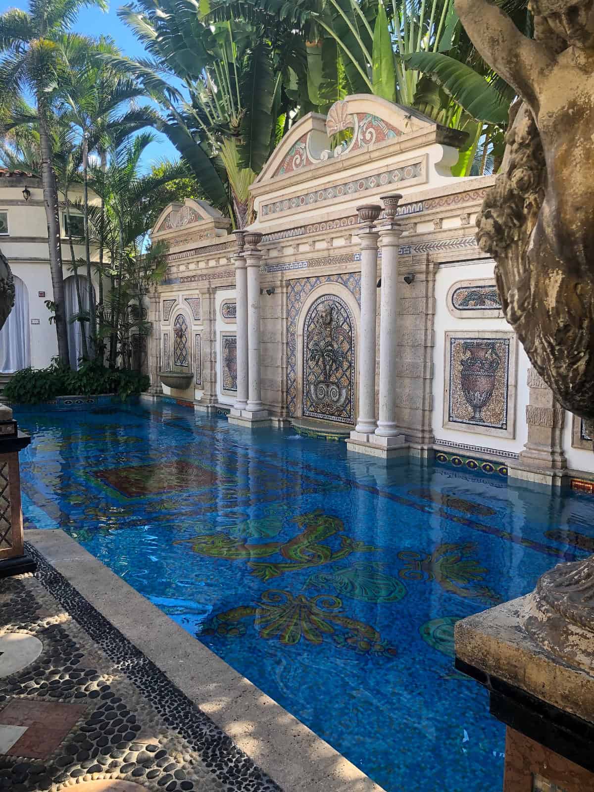 A serene pool featuring elegant statues, creating a tranquil and artistic atmosphere.
