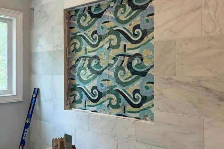 Freshly installed Osalli mosaic by MEC on a bathroom wall niche in Virginia USA